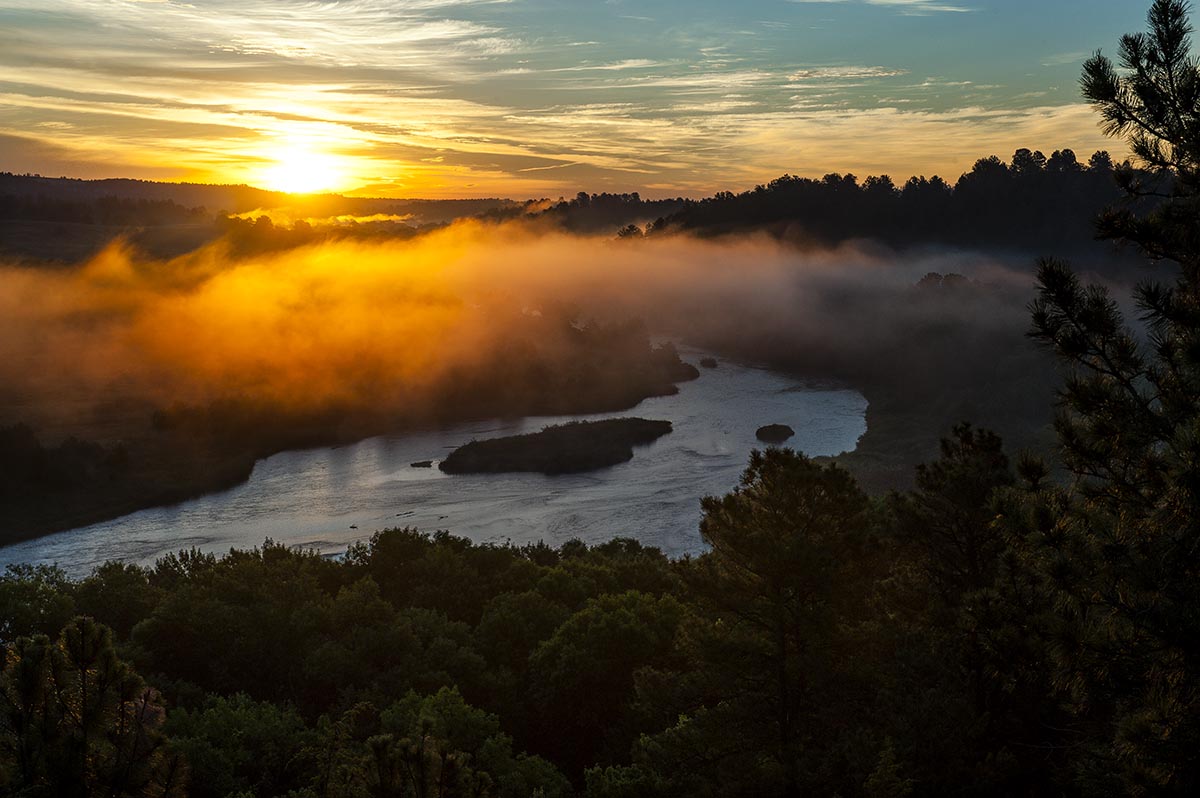 The sun rises over the Niobrara River at Chat Canyon WMA, Cherry County. Photo by Eric Fowler.